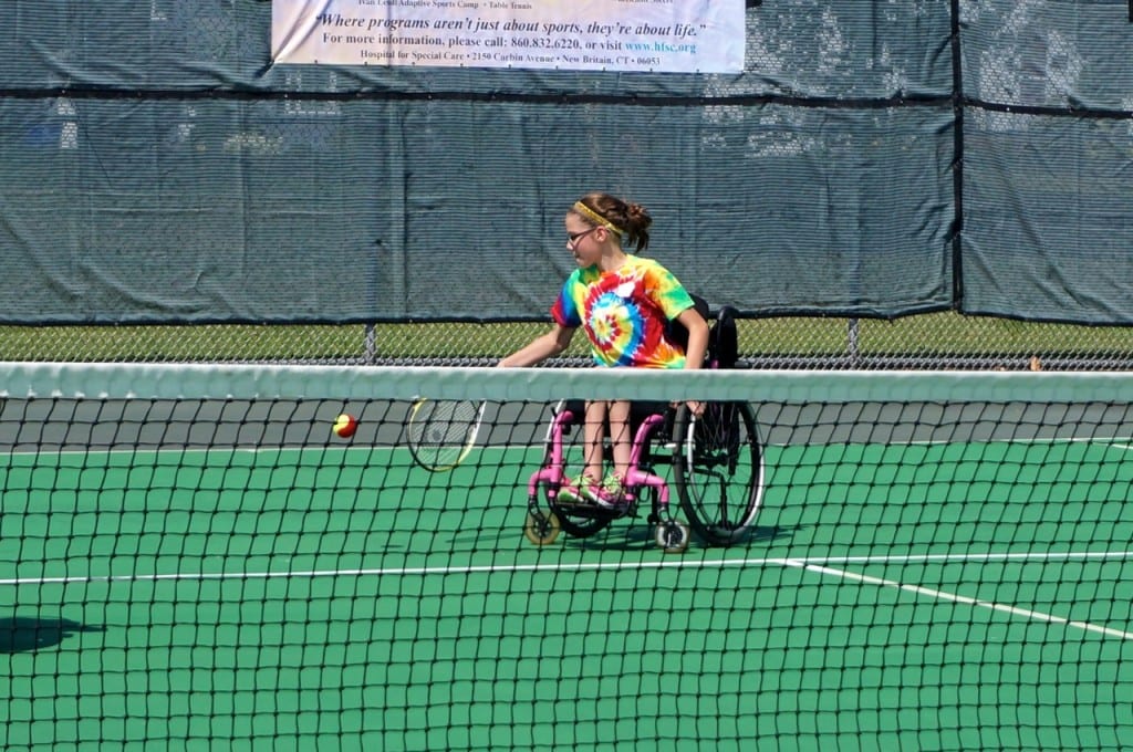 A camper practices tennis at the Ivan Lendl Adaptive Sports Camp at the University of Saint Joseph in West Hartford. Photo credit: Ronni Newton