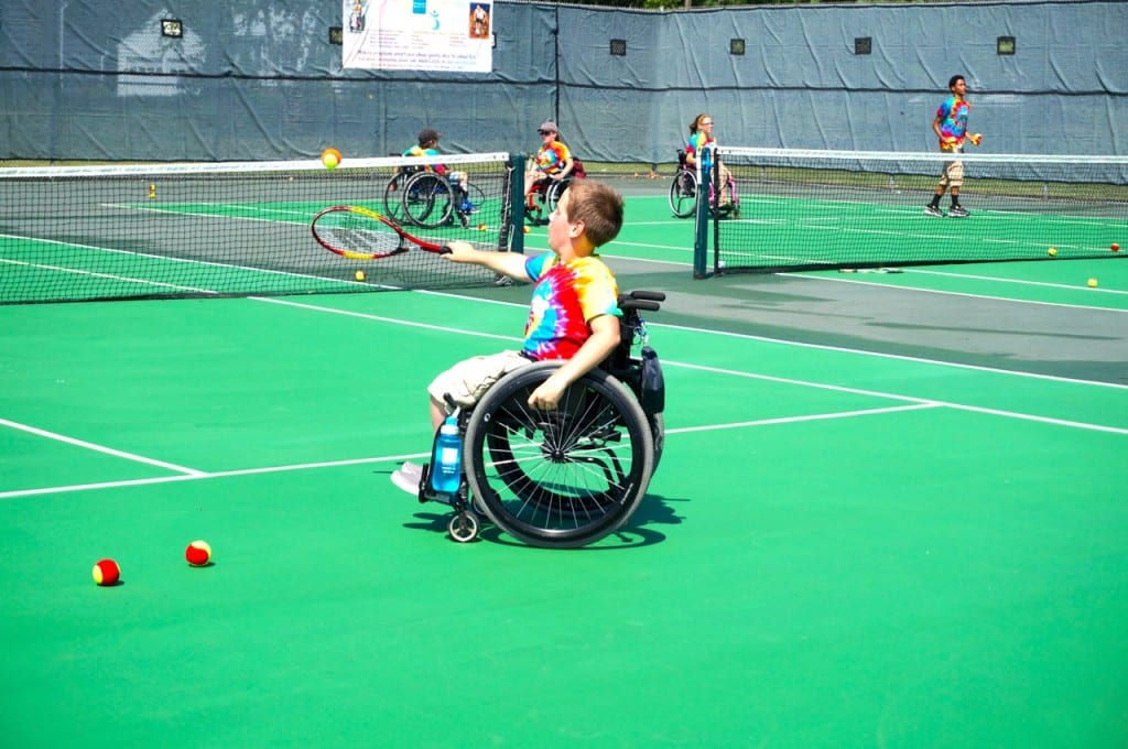 A camper practices tennis at the Ivan Lendl Adaptive Sports Camp at the University of Saint Joseph in West Hartford. Photo credit: Ronni Newton