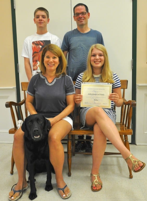 The Kneidel family with Debra, their puppy who will become a guide dog. Submitted photo