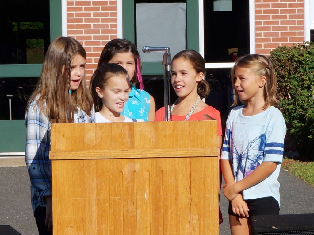 The Braeburn Singers sing "America" at the school's annual opening day flag ceremony. Photo credit: Ronni Newton
