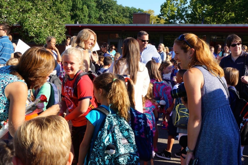 Students, teachers, and parents gather on the blacktop behind Braeburn Elementary School for the annual opening ceremony. Photo credit: Ronni Newton