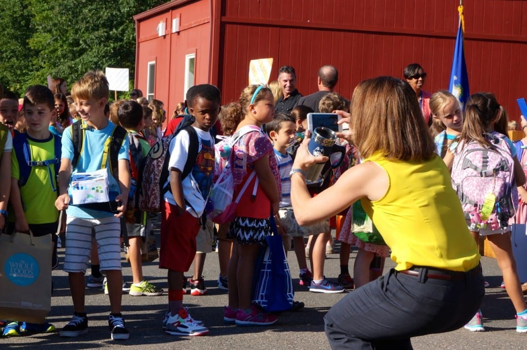 One mom grabs a last-minute photo of her child and classmates before the school day begins. Photo credit: Ronni Newton