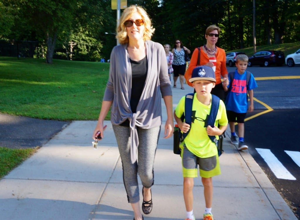 Patrice Neidle and her son Jackson head up the walk to Braeburn Elementary School Wednesday morning. Jackson is in Mr.s Burns' third grade class. Photo credit: Ronni Newton