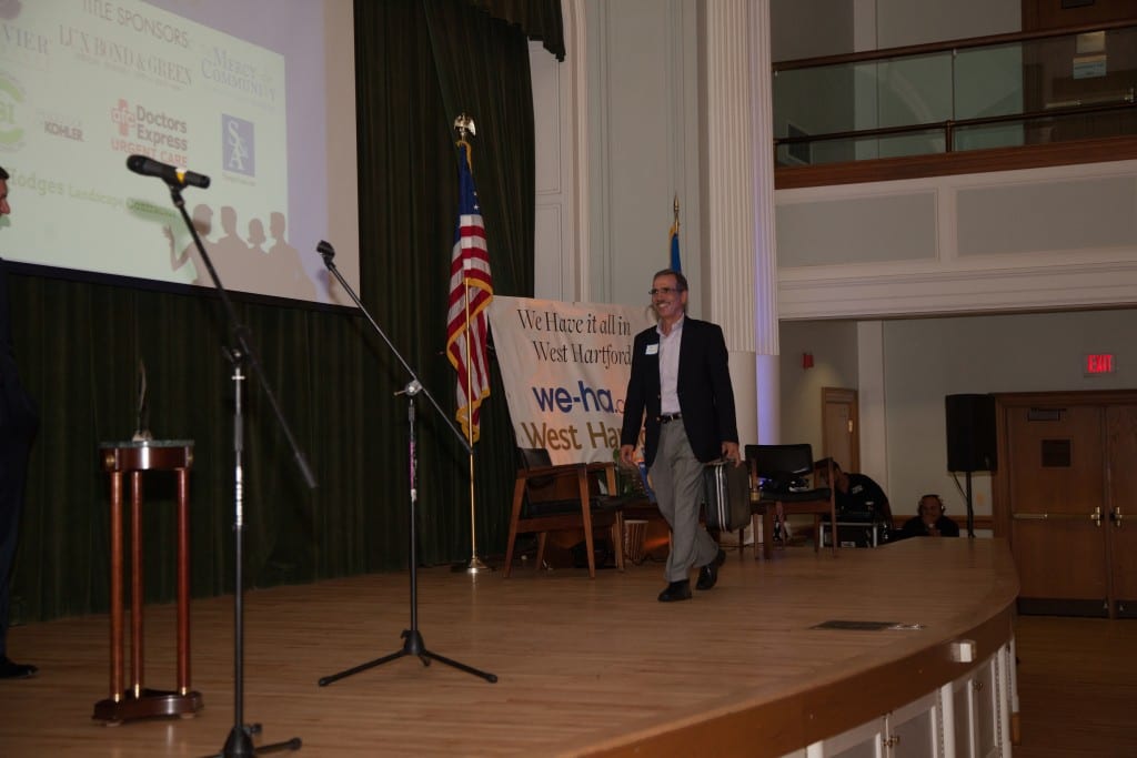 Tom Filomeno presents the briefcase of winning names at the Best of West Hartford Awards Show, September 10, 2015 at West Hartford Town Hall. photo by Mick Melvin