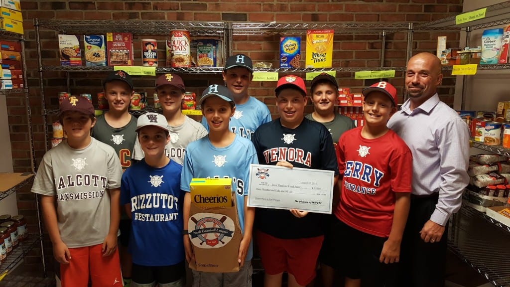 West Hartford Youth Baseball League players make a large donation to the Food Pantry based on the number of home runs hit during the league's spring season. Submitted photo