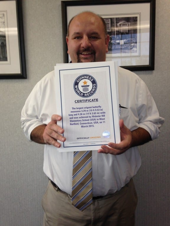 Superintendent Tom Moore holds the official certificate from Guinness World Record. Submitted photo