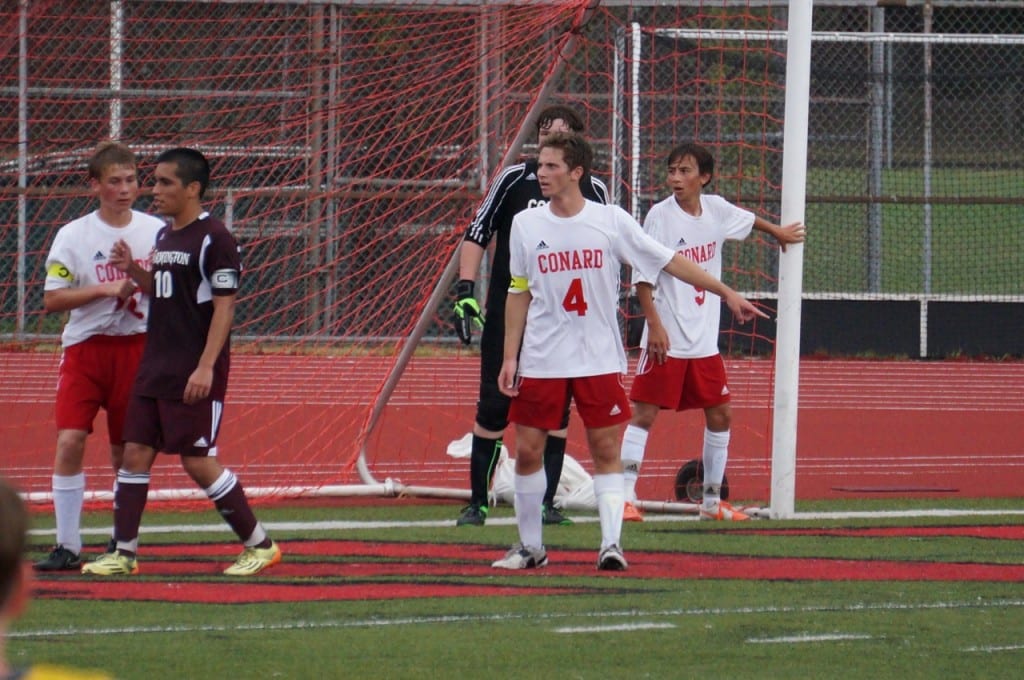 The Conard boys soccer team held a scoreless tie for 56 minutes against nemesis Farmington before the Indians finally scored on a corner kick. Pictured in the first half, Conard's defense and midfielders set up for one of Farmington's dozen or so corner kicks. Photo credit: Ronni Newton