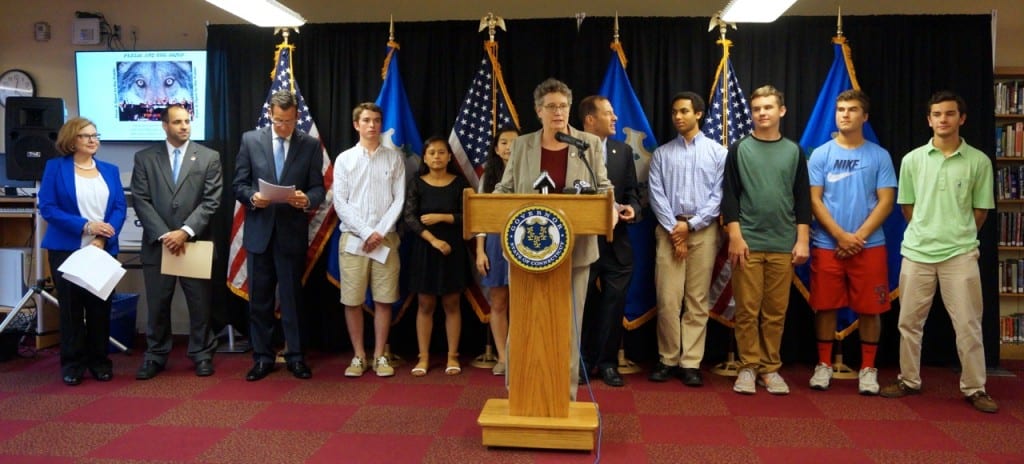 State Sen. Beth Bye speaks in the Conard High School library highlighting the state's replacement of the SBAC with SAT for high school juniors. Also at the announcment were (from left) SDE Commissioner Diana Wentzell, Conard Principal Julio Duarte, Gov. Dannel P. Malloy, Conard students Brian Wilson, Mamata Malla, Molly Petrizzo, State Rep. Andrew Fleischmann, Conard students Anis Ehsani, Henry FIsher, Tyler Carson, and Jack Moore. Photo credit: Ronni Newton