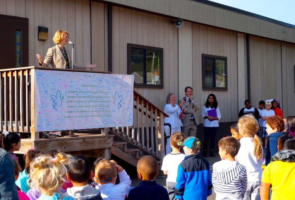 Parent Joanna Curry-Sartori leads the Charter Oak community in a mindfulness exercise. Photo credit: Ronni Newton