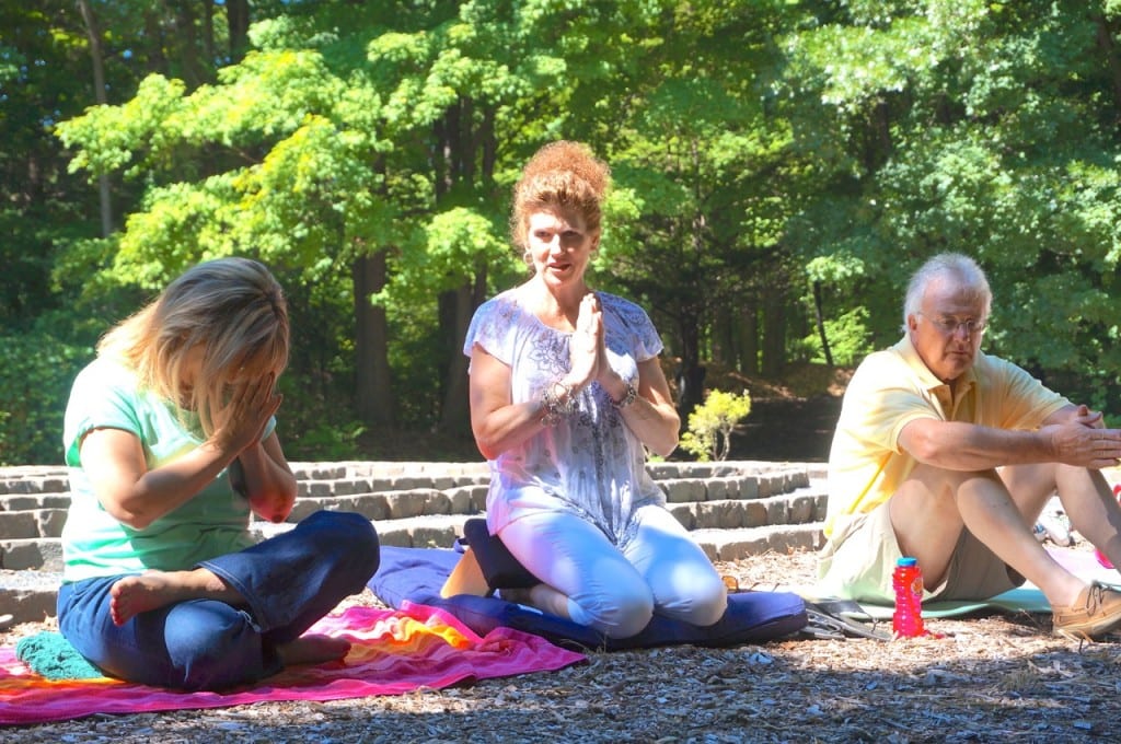 Kim Green joins friends in a meditation at the labrynth at the Copper Beech Institute in West Hartford on Aug. 2. At right is her husband, Ken Green. Photo credit: Ronni Newton