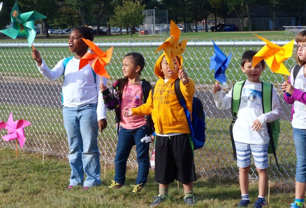 Students show off their pinwheels before planting them. Photo credit: Ronni Newton