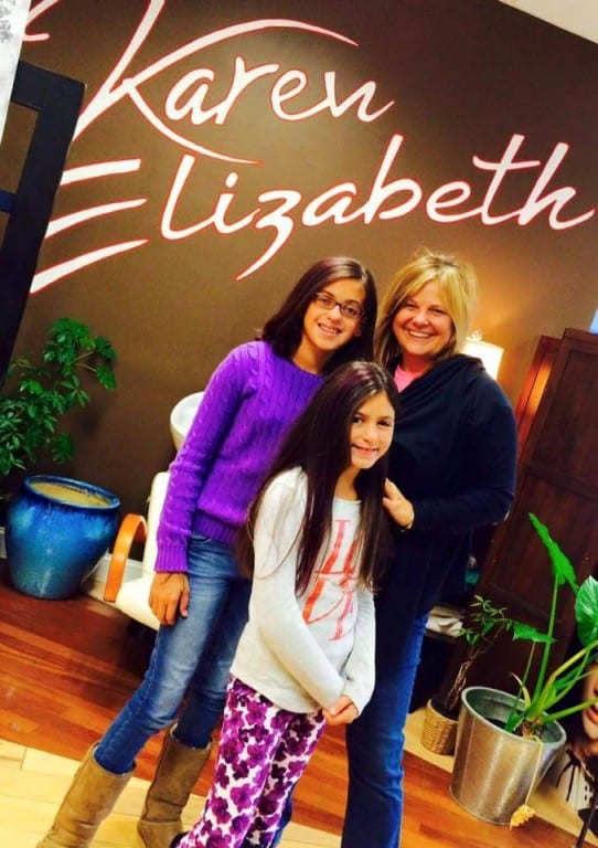 Karen Elizabeth Salon & Academy is offering free haircuts and styling to anyone with breast cancer or who brings a friend with breast cancer during the month of October, and also offering pink strands for $10. Karen Roche (at right) with Gabriella (left) and Francesca Giordano who are both sporting pink strands in honor of their great aunt, "E" Elaine Deasy, who is battling breast cancer for the second time. Photo courtesy of Karen Roche