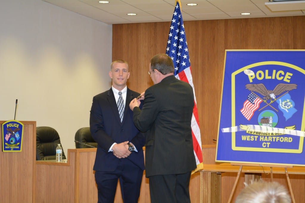 Det. Harrison is pinned by his father, Robert, a forensic investigator and fraud examiner. Photo courtesy of West Hartford Police Department
