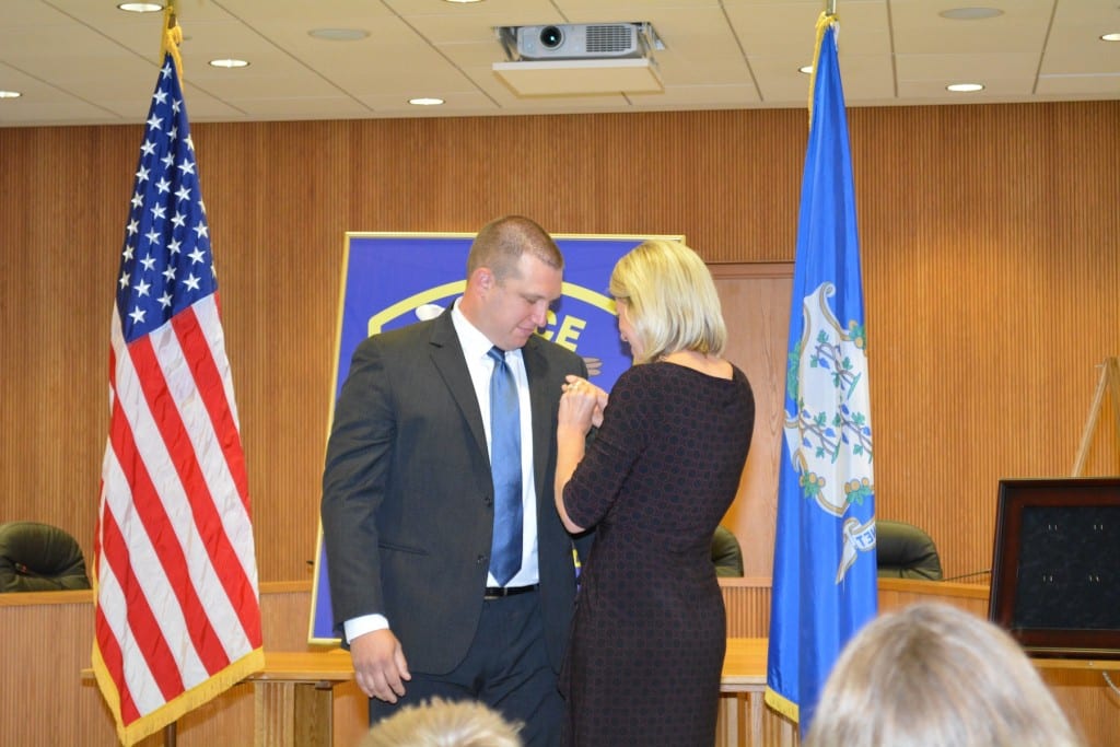 Det. Raywood, whose promotion was announced on Friday, Oct. 2, is pinned by his wife, Laura. Photo courtesy of West Hartford Police Department