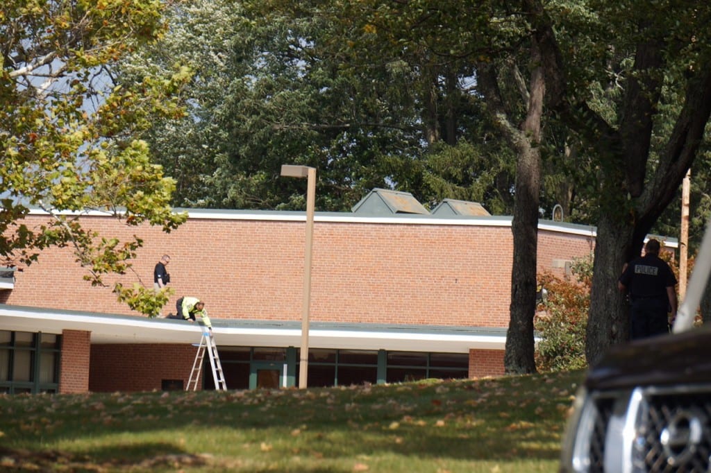 Police complete a check of the roof of Solomon Schechter Day School in West Hartford following an alleged suspicious message. Photo credit: Ronni Newton