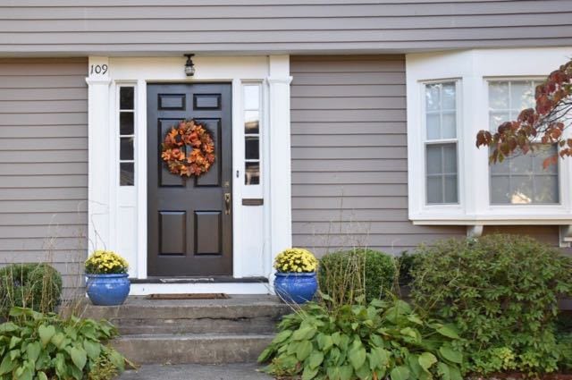Love the bright blue pots and yellow mums along with the fall wreath. Photo credit: Deb Cohen