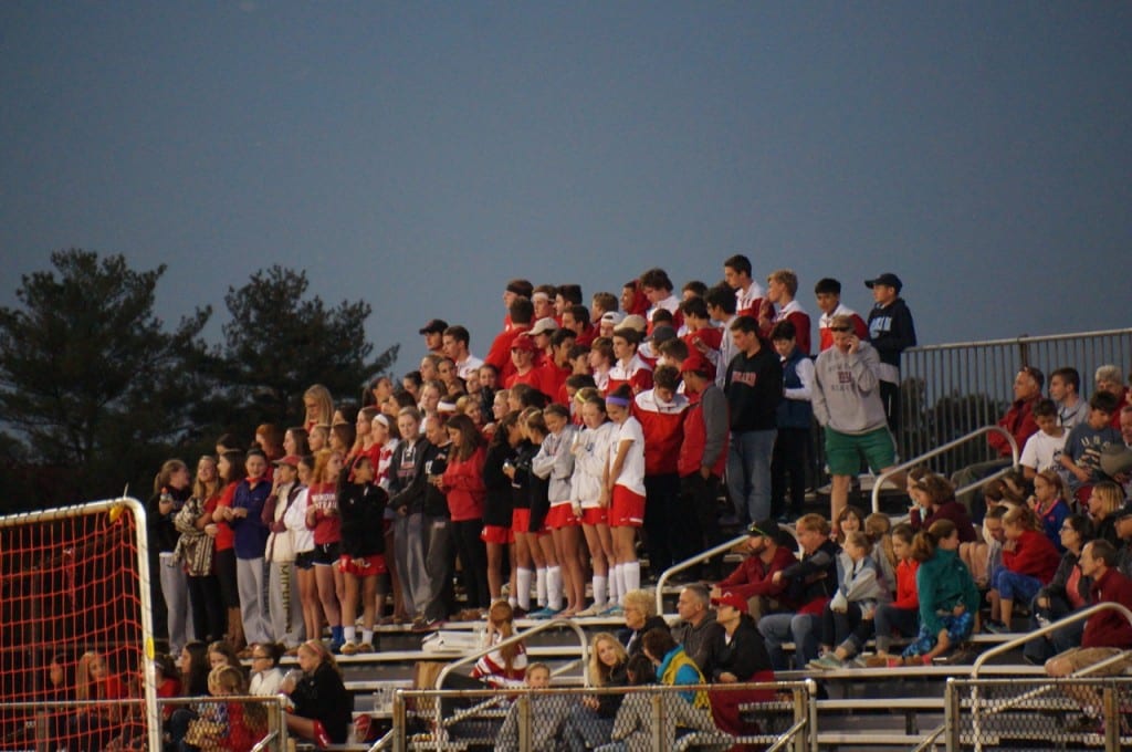 Conard fans, including many members of the boys soccer team, cheered on their girls. Hall vs. Conard girls soccer. Oct. 12, 2015. Photo credit: Ronni Newton