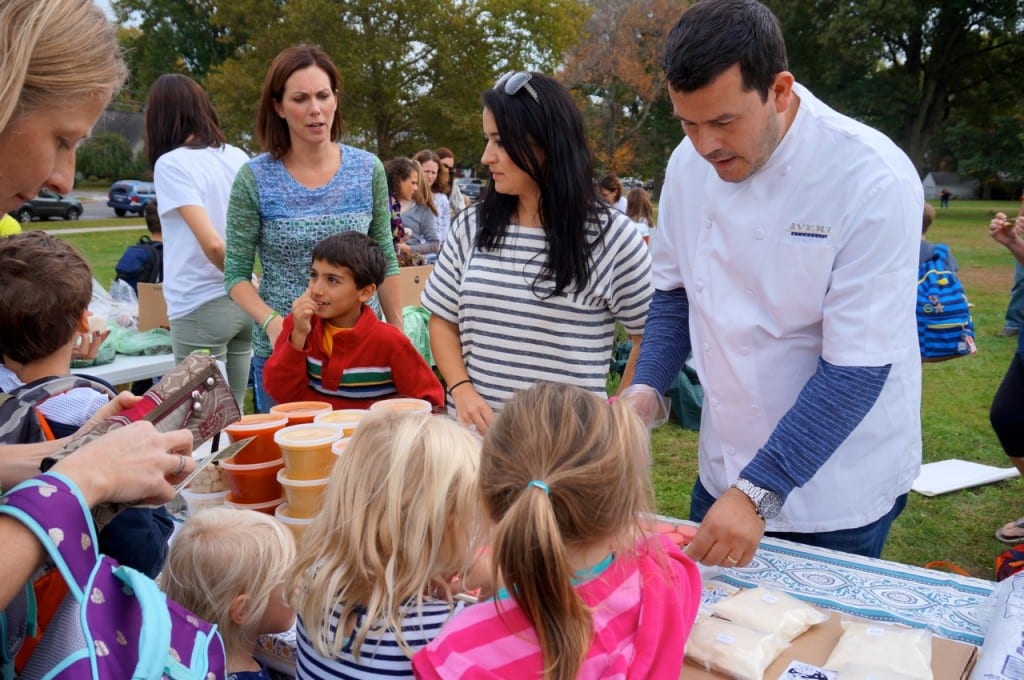 Chef and restauranteur Dorjan Puka (right) and his wife Mira brought locally-made foods like soup, gnocchi, sauce, and cheese to the Webster Hill farmer's market on Oct. 22. Photo credit: Ronni Newton