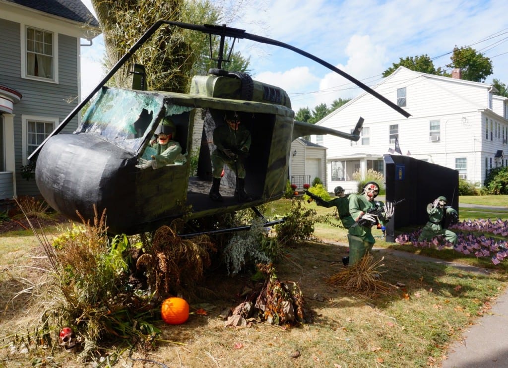Matt Warshauer's 2015 Halloween display at his North Main Street home in West Hartford includes a Huey helicopter replica. To the north is a replica of the Vietnam Veteran's Memorial Photo credit: Ronni Newton