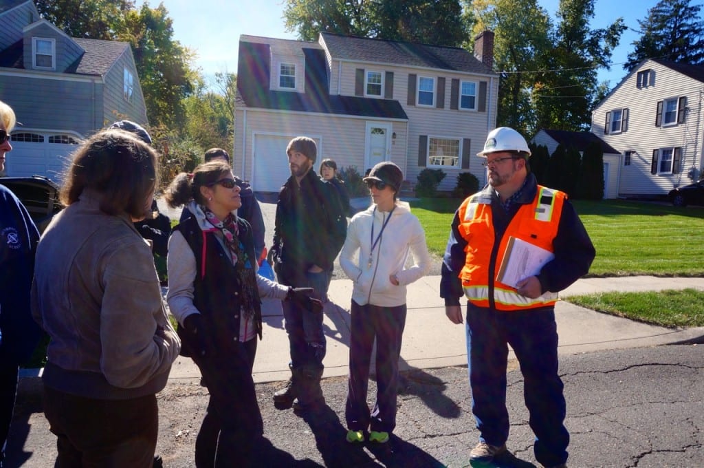 Linbrook Road resident Michelle Souza (left, in black down vest) speaks with DEEP Project Manager Dan Biron (right). Photo credit: Ronni Newton