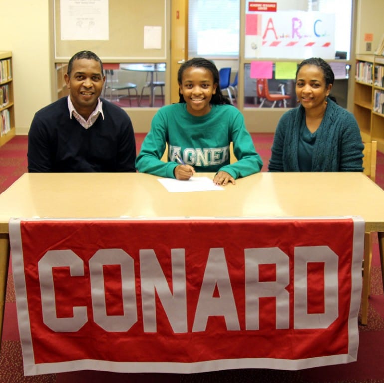 Conard senior Taylor Davis (center) signs her Letter of Intent with her parents. Photo courtesy of Betty Remigino-Knapp