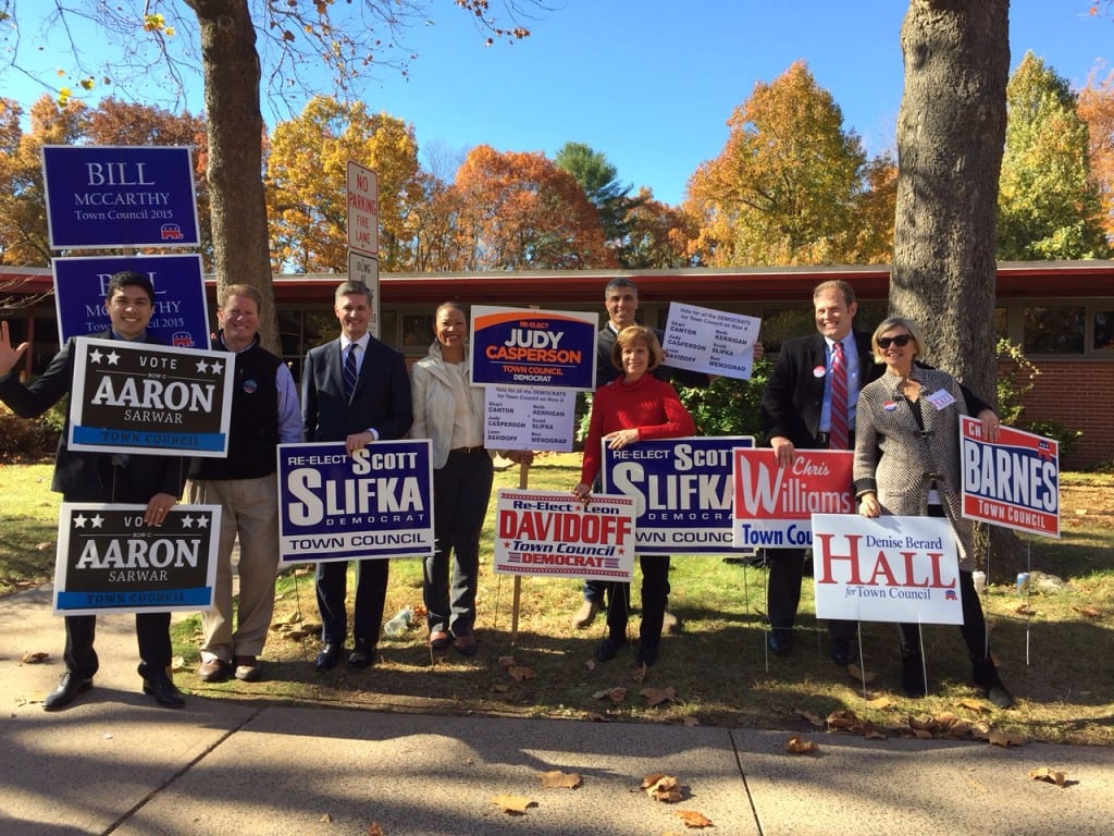 Candidate and supporters do some last minute campaigning outside Braeburn Elementary School. From left: Aaron Sarwar, Chip Simplicio, Scott Slifka, Judy Casperson, John Bailey, Janeace Slifka, Chris Williams, and Denise Hall. Photo credit: Ronni Newton