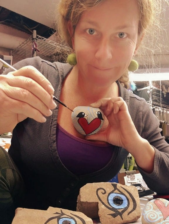 Artist Stefanie Marco paints one of the rocks for the 'Twelve Days of Finders Keepers.' Contributed photo