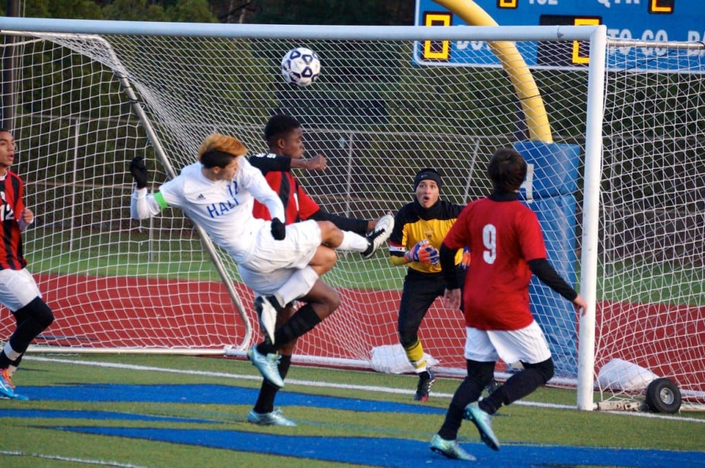Hall senior captain AJ Speranza takes a shot. Hall vs. Bridgeport Central Class LL Soccer. Photo credit: Ronni Newton