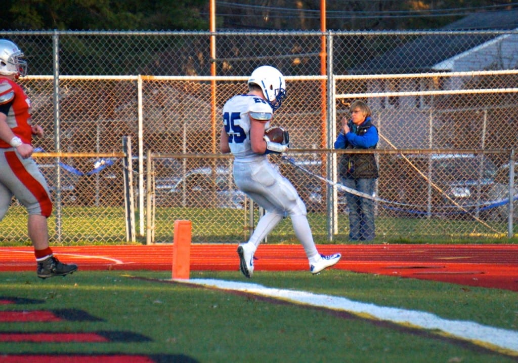 Hall's Theo Blaschinski runs for a touchdown late in the game. Annual Conard vs. Hall West Hartford Mayor's Cup football game. Nov. 21, 2015. Photo credit: Ronni Newton