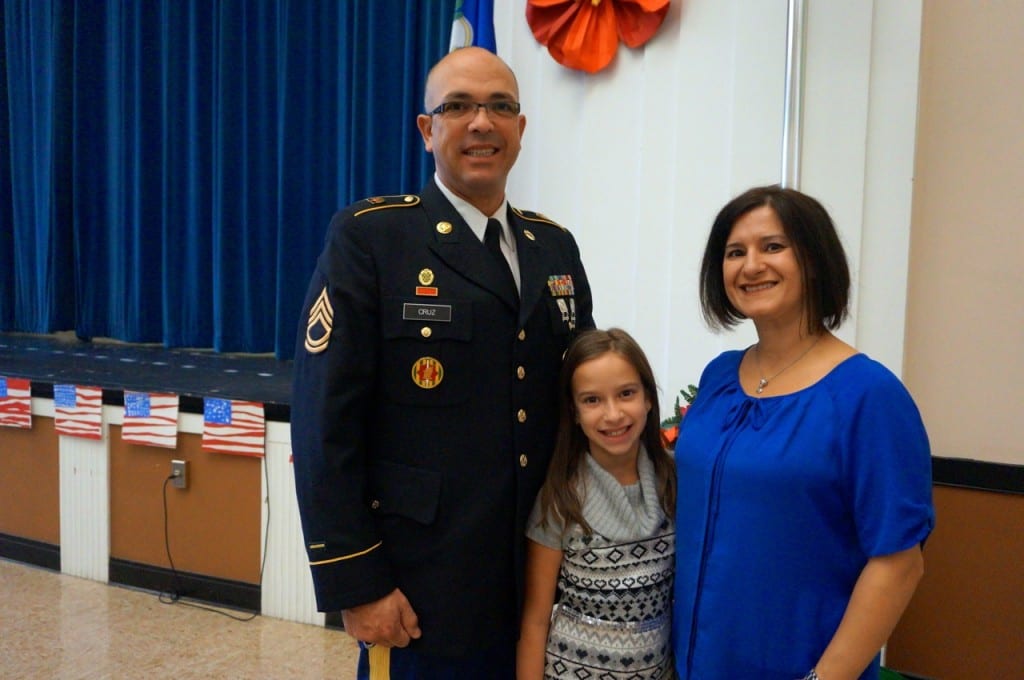 Juan Cruz (pictured with his wife and daughter Olivia, a third-grader at Charater Oak) sang the National Anthem. Veterans Day 2015. Photo credit: Ronni Newton