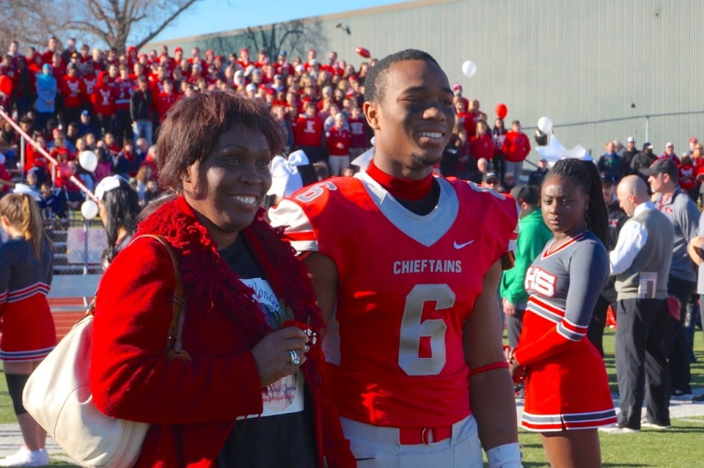Nate Richam with his mom, Michelle. Annual Conard vs. Hall West Hartford Mayor's Cup football game. Nov. 21, 2015. Photo credit: Ronni Newton