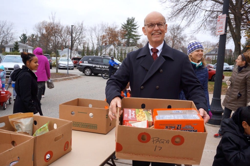 Town Manager Ron Van Winkle helps the Morley students unload their wagons and cartons of donated food into West Hartford Town Hall. Morley Red Wagon Food Drive, Nov. 18, 2015. Photo credit: Ronni Newton