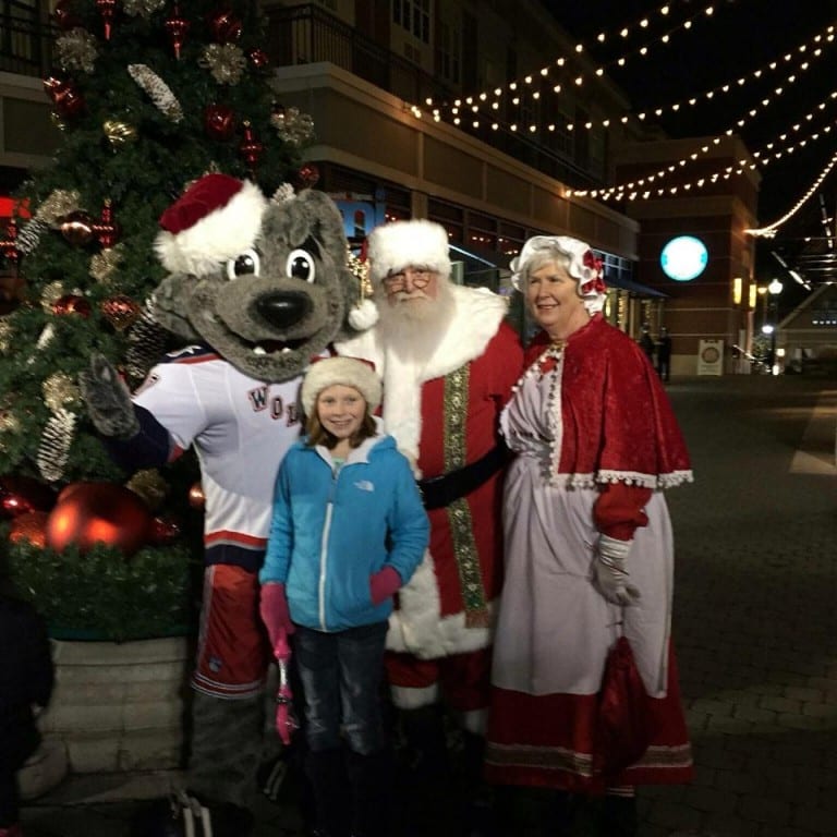 Allie Sullivan helped Santa and Mrs. Claus light the Blue Back Square Christmas Tree in 2014. Photo courtesy of Emily Sullivan