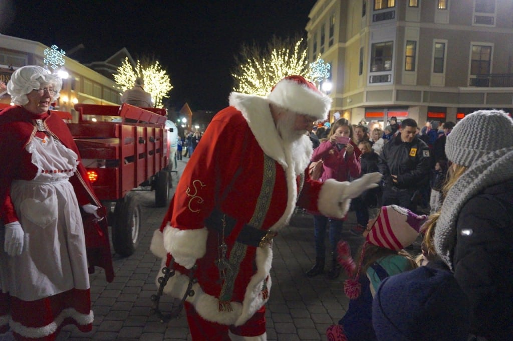 Santa high-fives some of his fans. West Hartford Holiday Stroll, Dec. 3, 2015. Photo credit: Ronni Newton