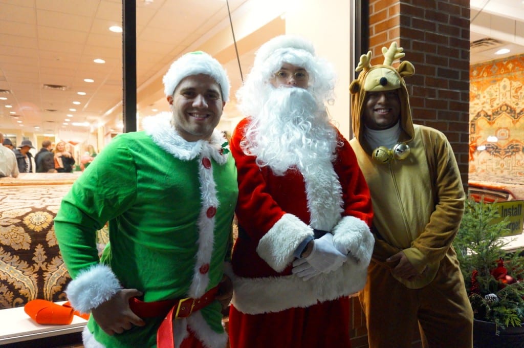 Another Santa and some "helpers" invited strollers into Kaoud Oriental Rug Gallery where animals from The Children's Museum were on display. West Hartford Holiday Stroll, Dec. 3, 2015. Photo credit: Ronni Newton