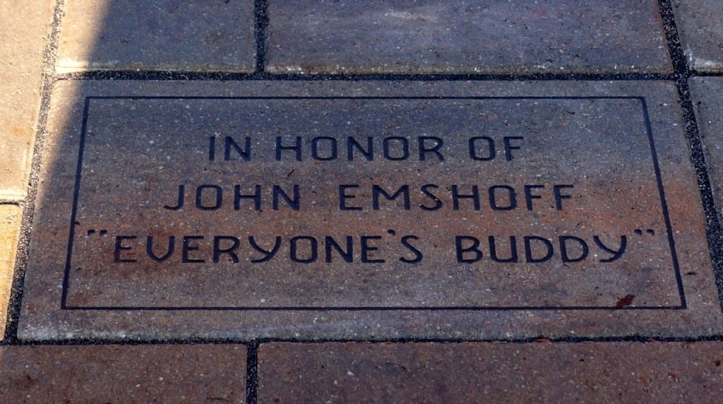 A special brick in front of Wolcott Elementary School's Buddy Bench dedicates it to John Emshoff – 'everyone's buddy.' Photo credit: Ronni Newton