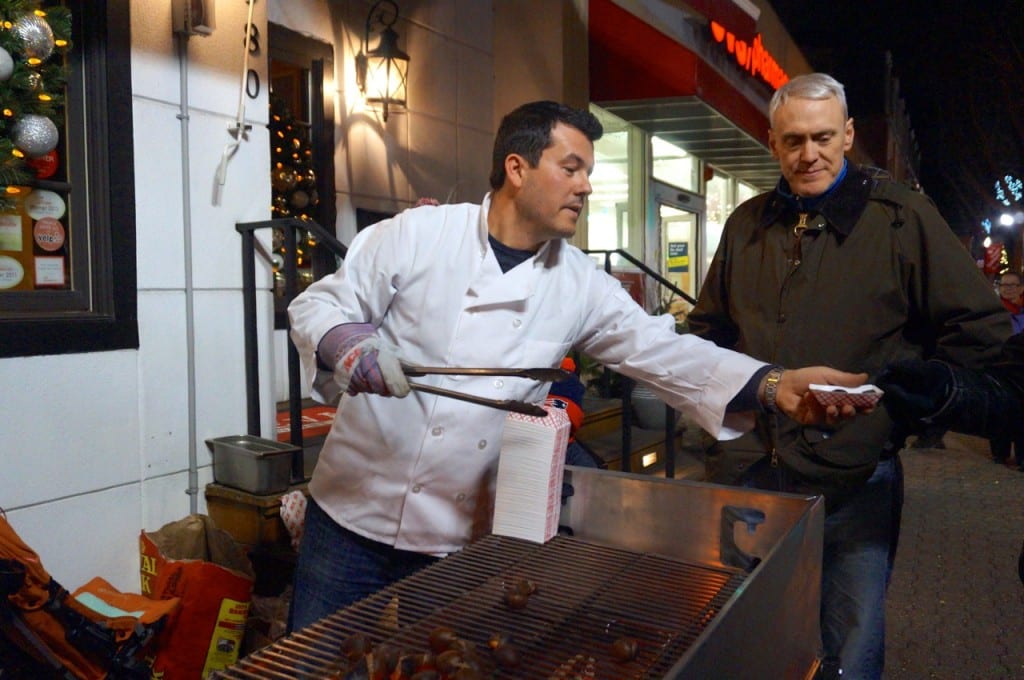 Chef/owner Dorjan Puka roasts chestnuts over an open fire outside Treva. West Hartford Holiday Stroll, Dec. 3, 2015. Photo credit: Ronni Newton