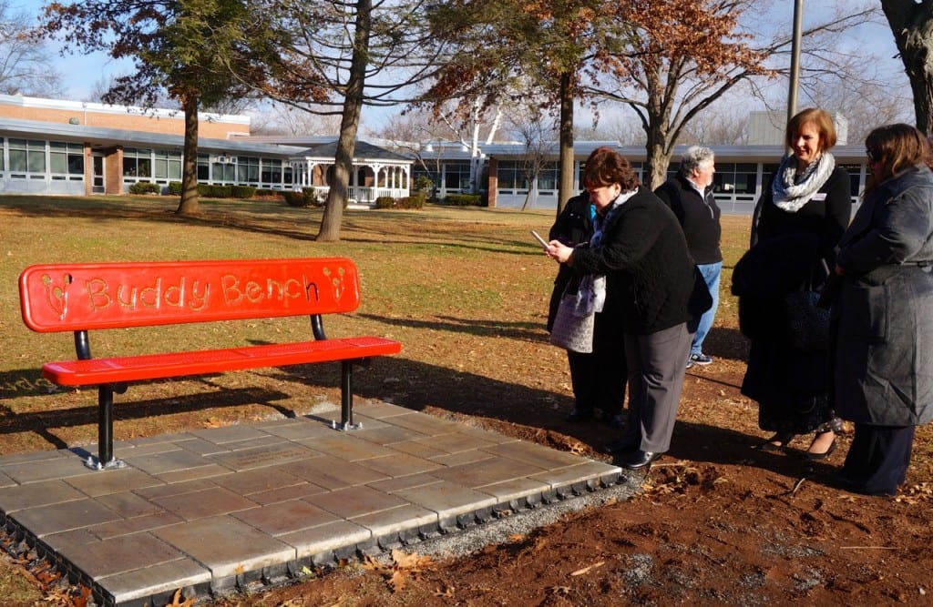 John Emshoff's family at the Buddy Bench. Photo credit: Ronni Newton