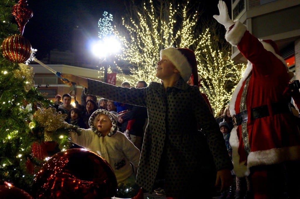 Kiley Sullivan (left) and Allie Sullivan light the Blue Back Square Christmas tree with the help of Santa. West Hartford Holiday Stroll, Dec. 3, 2015. Photo credit: Ronni Newton