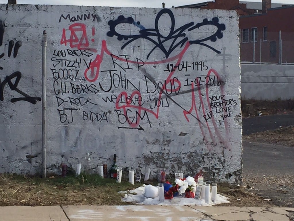 A makeshift memorial has been set up on Francis Avenue in Hartford near the site where Jonathan Douglin was fatally stabbed early on New Year's Day. Photo credit: Ronni Newton