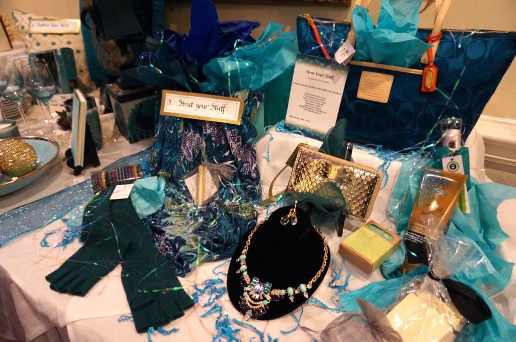 Baskets for the basket raffle all had peacock-themed names like 'Strut Your Stuff.' 17th annual Children's Charity Ball, Jan. 23, 2016. Photo credit: Ronni Newton