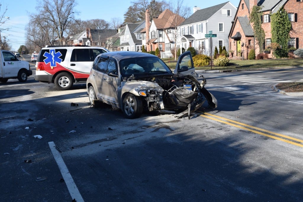 This PT Cruiser was heavily damaged after the driver ran a stop sign and collided with a Greater Hartford Transit van Tuesday morning, police said. Photo courtesy of West Hartford Police