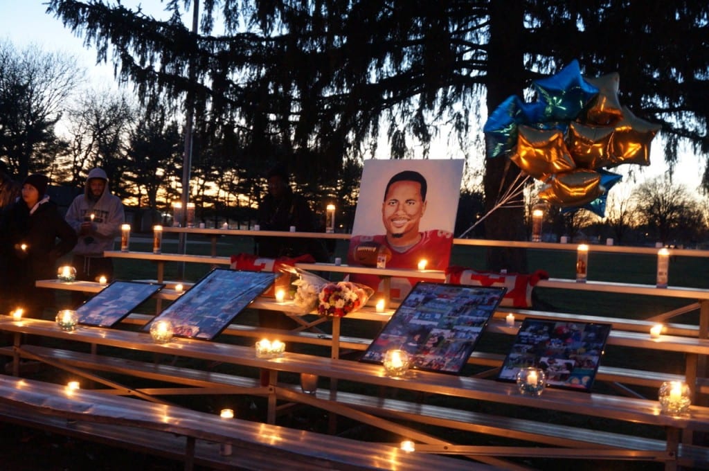 Candles, photographs, flower, and a painting of Jonathan Douglin by Conard High School graduate Cole Stabnick were on display at Sterling Field where a vigil was held on Wednesday, Jan. 6, 2016. Photo credit: Ronni Newton
