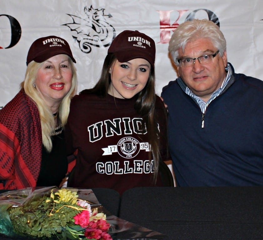 Brittany Schwartz of West Hartford (center) with her parents at the signing celebration. Photo credit: Michelle Murphy