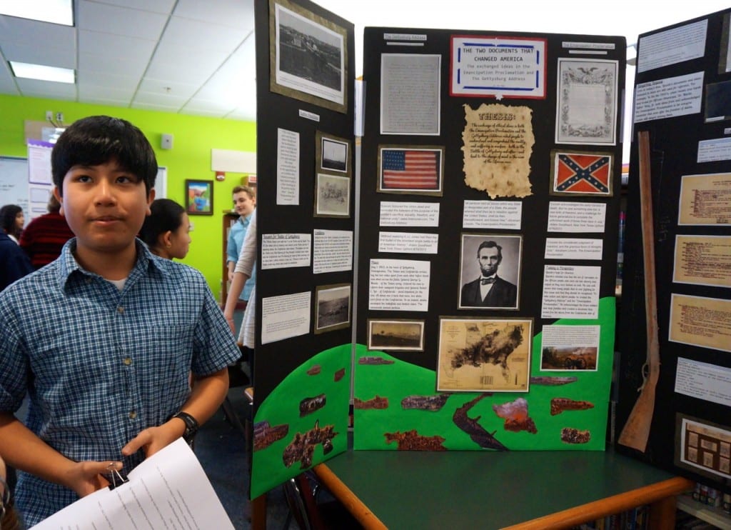 Max Mega shows off his exhibit on the Gettysburg Address and Emancipation Proclamation at History Day at Sedgwick Middle School. Photo credit: Ronni Newton