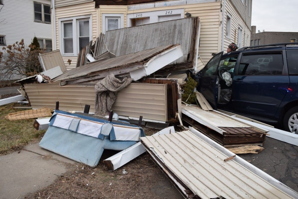 A 2004 Toyota Sienna hit a multi-family home on South Quaker Lane Tuesday morning, toppling all three levels of porches. Photo courtesy of West Hartford Police
