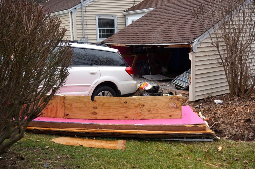 A West Hartford resident drove through her garage, out the back, and into a neighbor's home. Photo credit: Ronni Newton