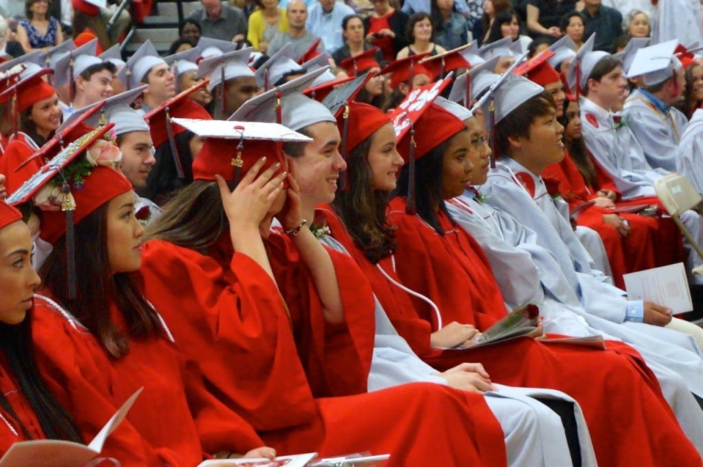 Conard graduates have traditonally been seated in alphabetical order, but beginning with the Class of 2016 male and female graduates will have their choice of red or gray gowns. Photo credit: Ronni Newton (we-ha.com file photo)