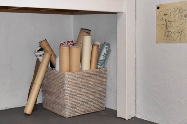 Scrolls in a basket are just one of many ways Ginny stores her vintage paper inventory. Photo credit: Deb Cohen