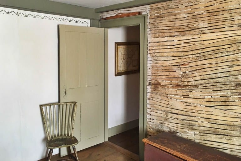 A wall left unfinished could be at home in today's popular industrial interior style. It is original 'sawn and cut lathe.' Photo credit: Deb Cohen 